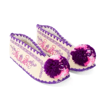 Colorful wool slippers typical from Greece with pompoms