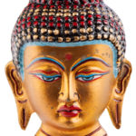 Golden buddhist mask depicting Buddha