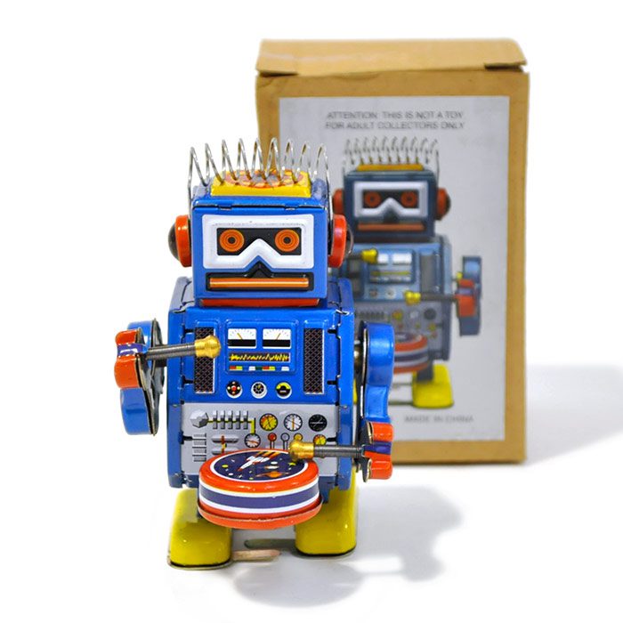 Drummer robot is a small tin wind-up toy with a futuristic look.